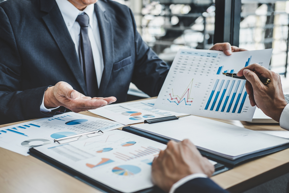 Finance manager meeting discussing company growth project success financial statistics